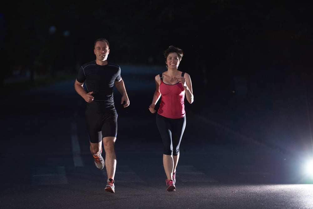 urban sports, healthy couple jogging in the city at early morning in night